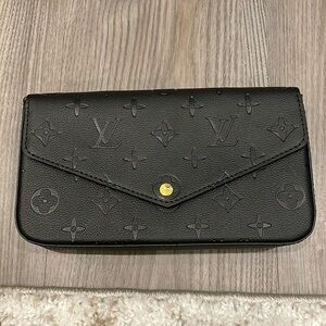 Black cross body bag with gold chain